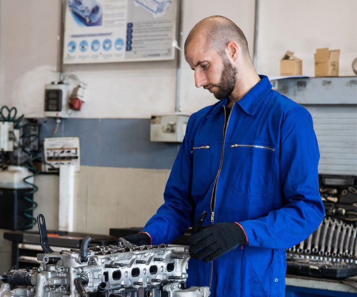 Mechanic Working on Engine 1 Mechanic Working on Engine 1